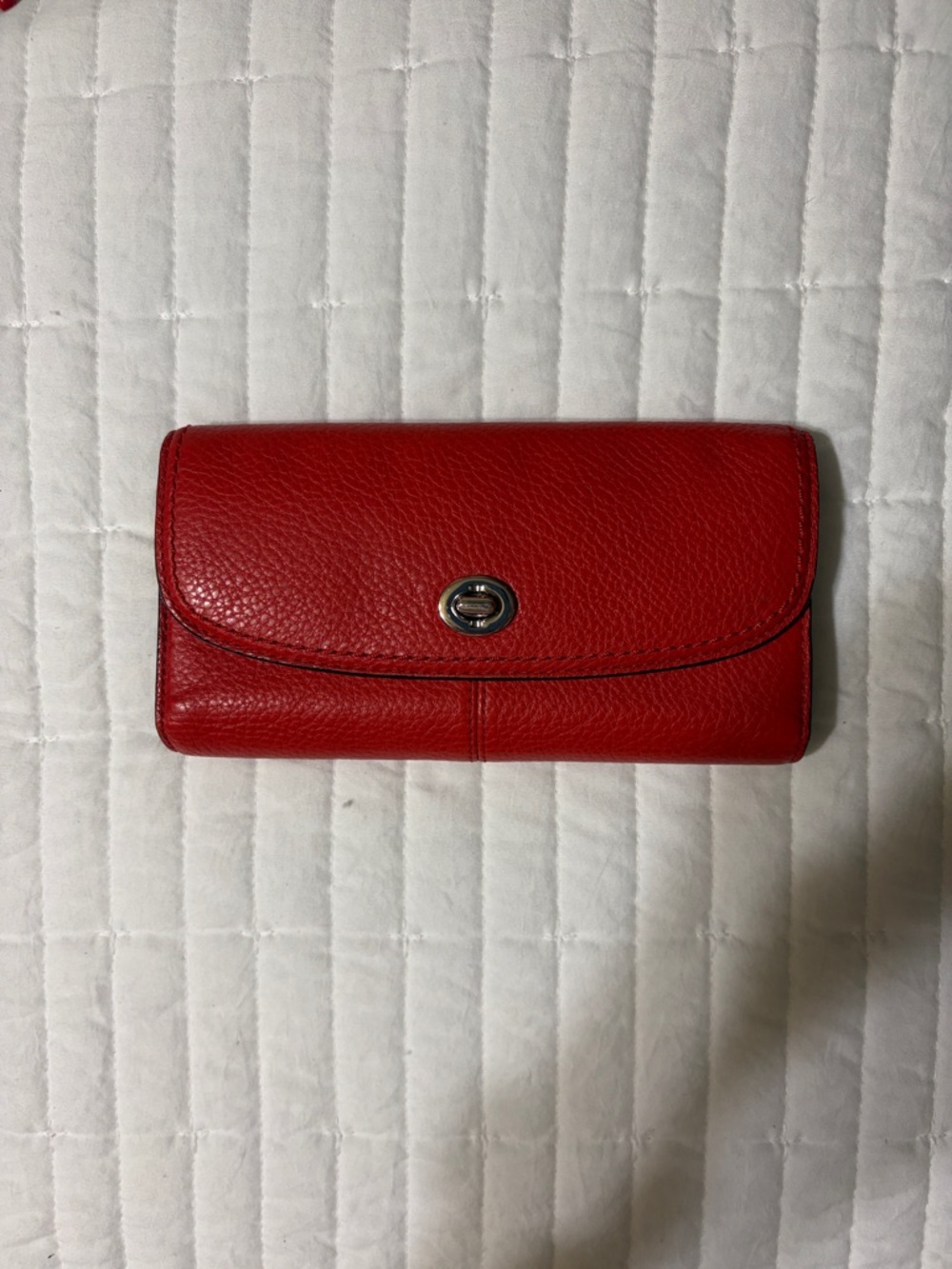 Coach “Park” pebbled leather wallet. Sienna colored w/ turn lock closure